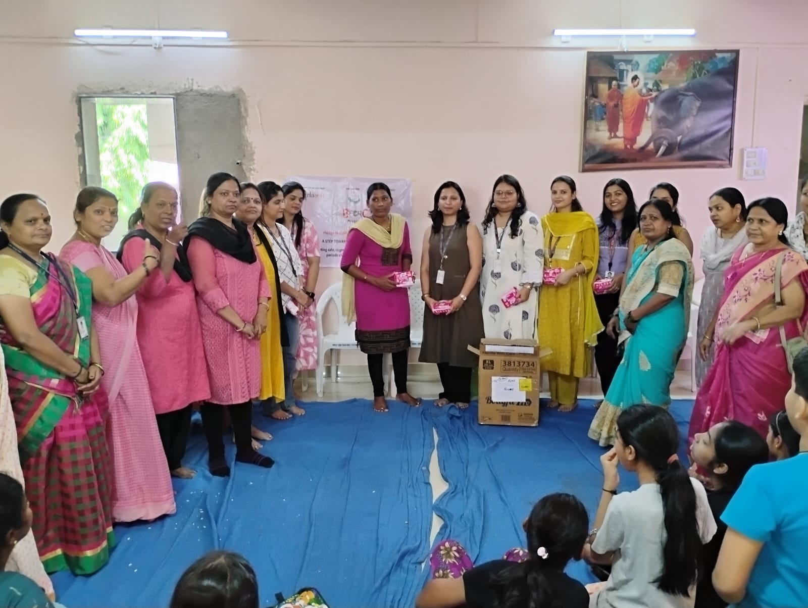 A group of people receiving free health check-ups at a community camp.