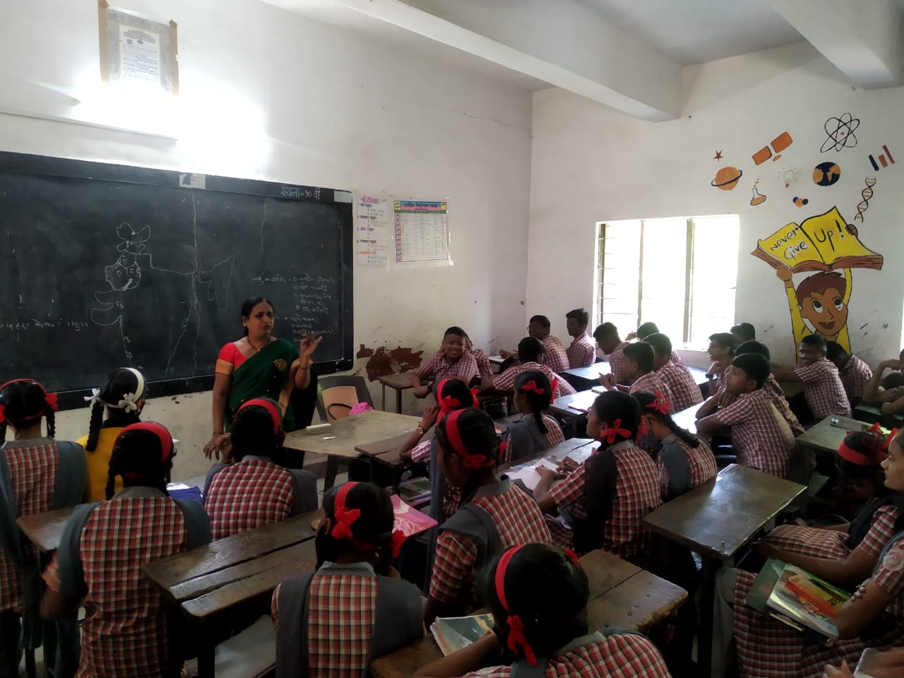 Children happily learning in a non-formal education class.
