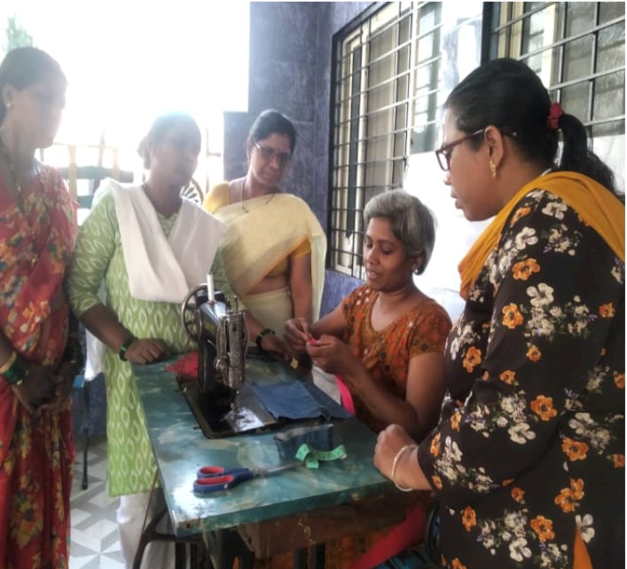 Women participating in a skill development workshop, learning new trades.